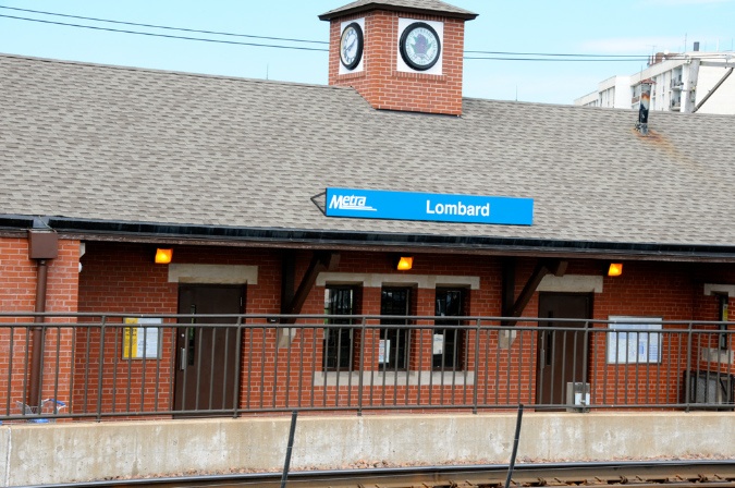 A train station with a clock on the roof.